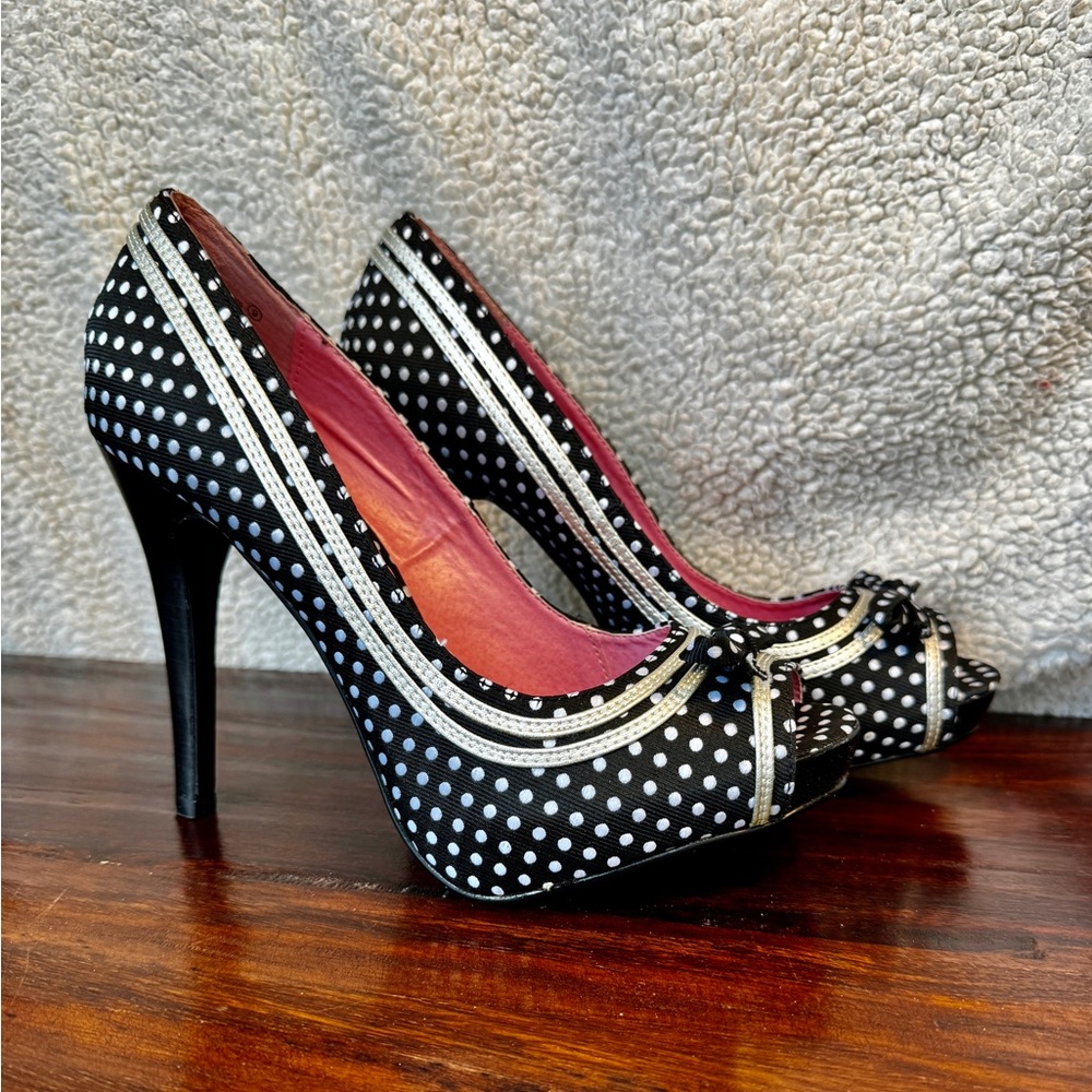 Not Rated stilleto heals. Size 9. Black with white tie polkadots.